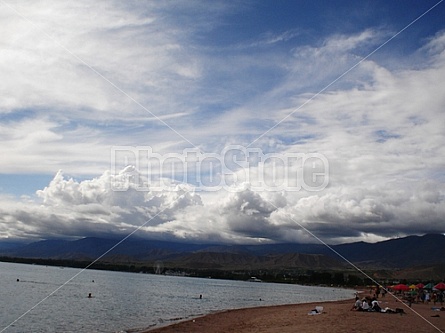 sun tries to get through the clouds at Issyk Kul Lake