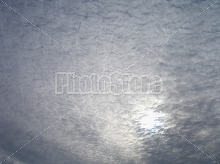 sun behind the clouds