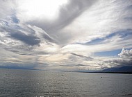 sun tries to get through the clouds at Issyk Kul Lake