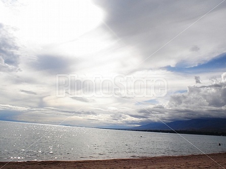 sun tries to get through the clouds at Issyk Kul Lake