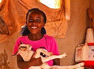 Kenyan girl and her pet goat