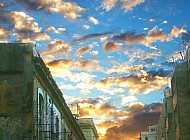 Cuban Sunset over buildings