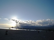 sun begins to sit over Issyk Kul Lake