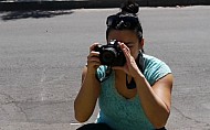 a woman taking pictures